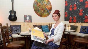 Image of lady in cafe - John Kelly Clare Champion