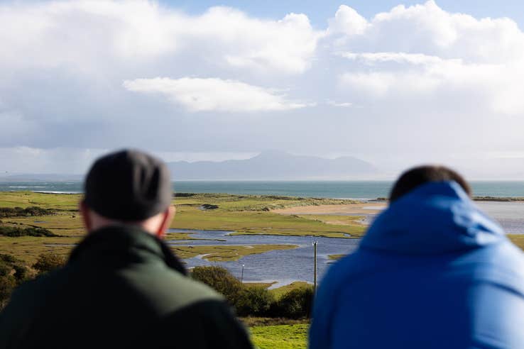 Two men in Mulranny village looking out over Clew Bay in Co Mayo