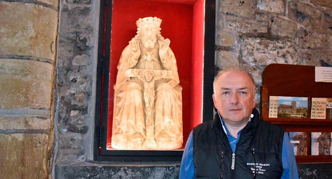 Pat your guide in the Black Abbey standing in front of an alabaster statue of the Holy Trinity