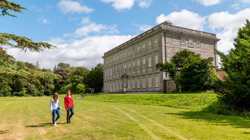 A couple walking through the grounds of Castletown House. 