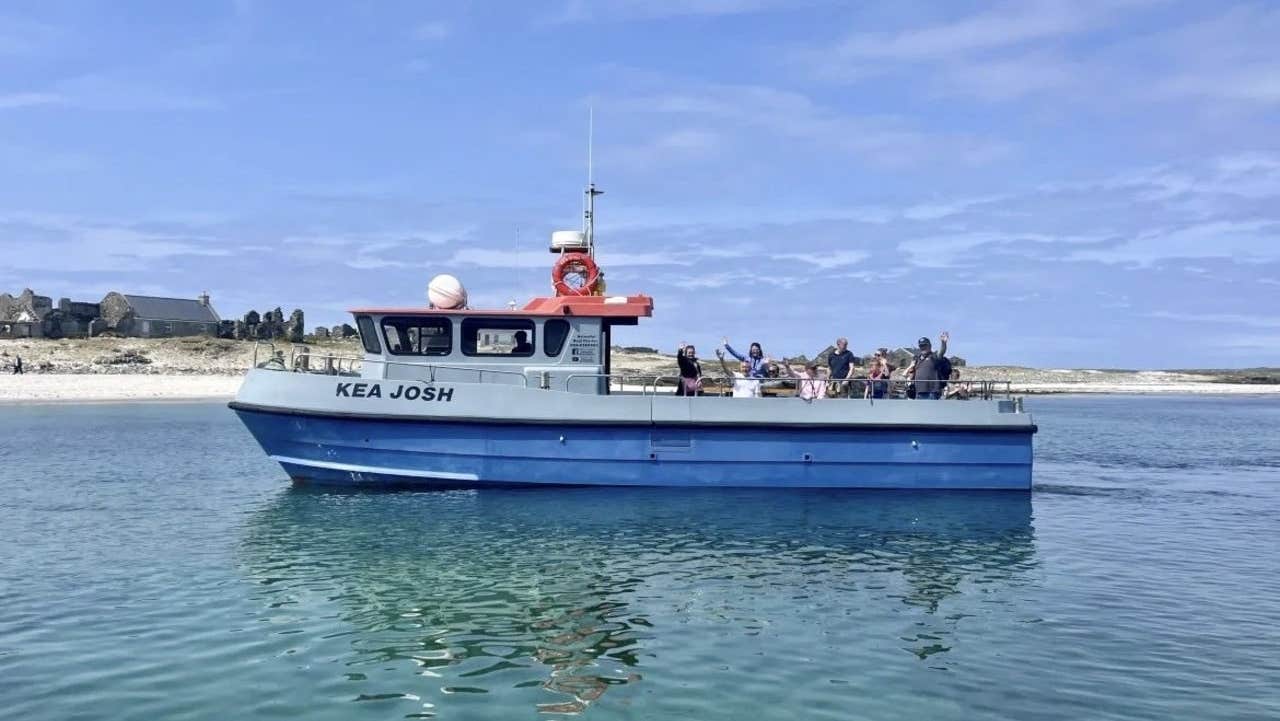 A boat with passengers on a sunny day