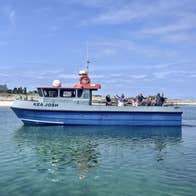 A boat with passengers on a sunny day