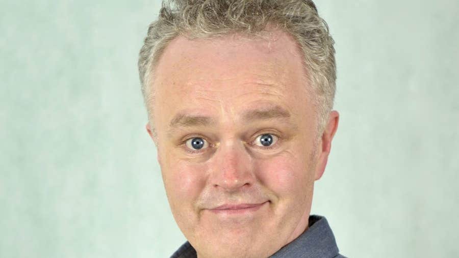 Comedian Patrick McDonnell, smiling looking slightly shocked.