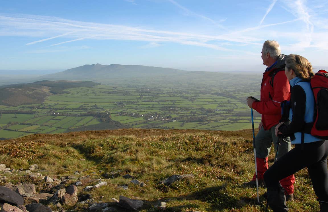 Two people in hiking gear walking Blackrock Loop, Ballyhoura, County Limerick