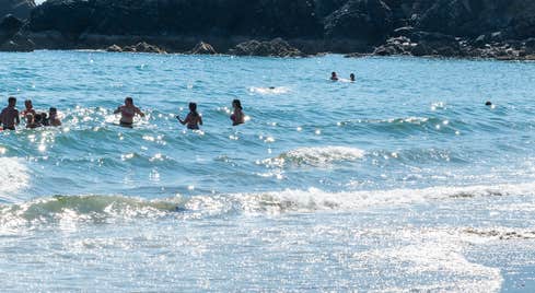 People swimming at Ballydowane Bay in County Waterford
