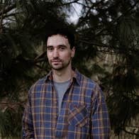 A conversation with Djamel White, a serious looking man in a checked shirt