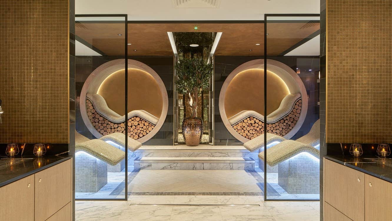 A spa with marble floors curved seating