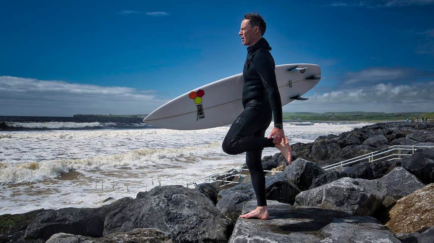 A surfer on Lahinch Beach in Co Clare