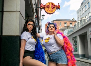 Drag brunch misses standing under café sign