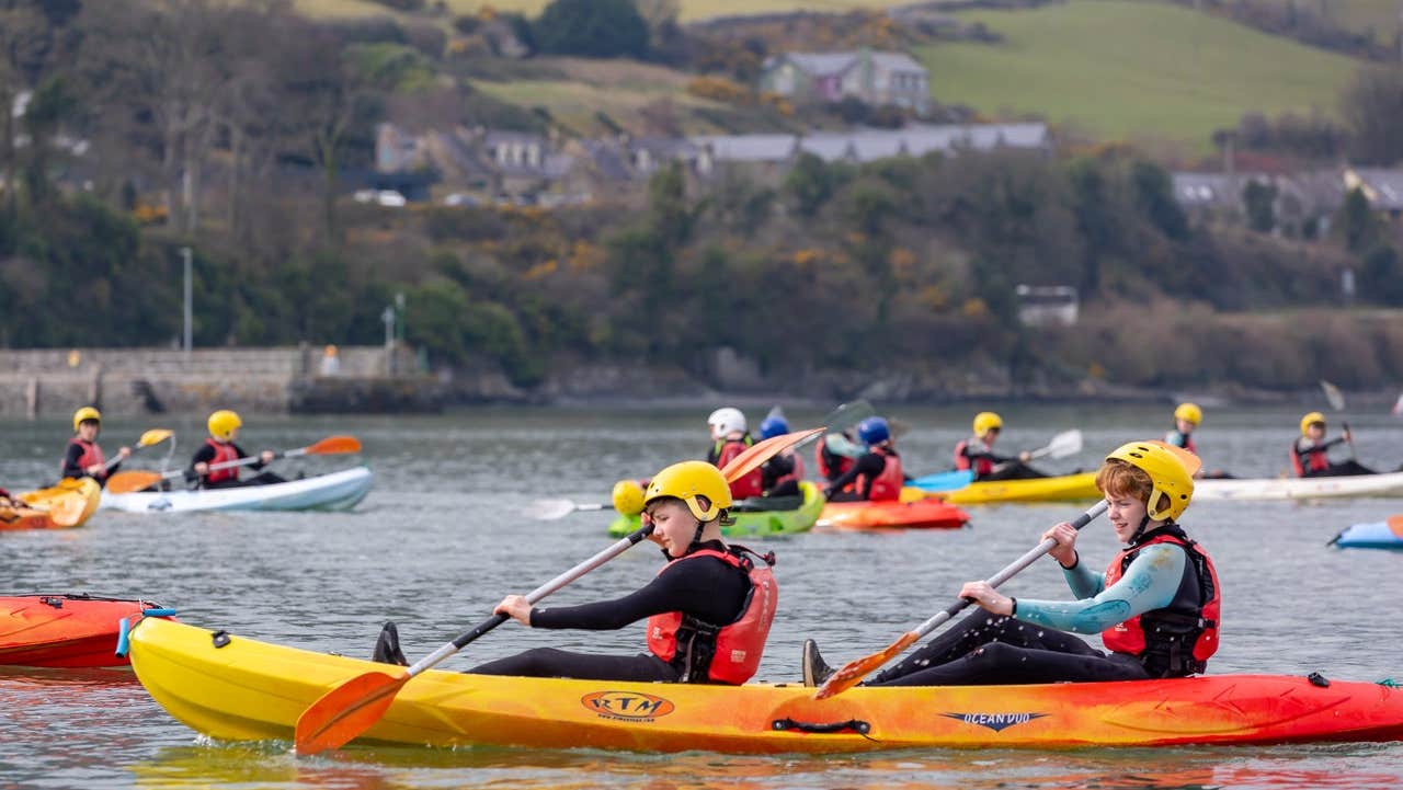 Kids kayaking on a lake