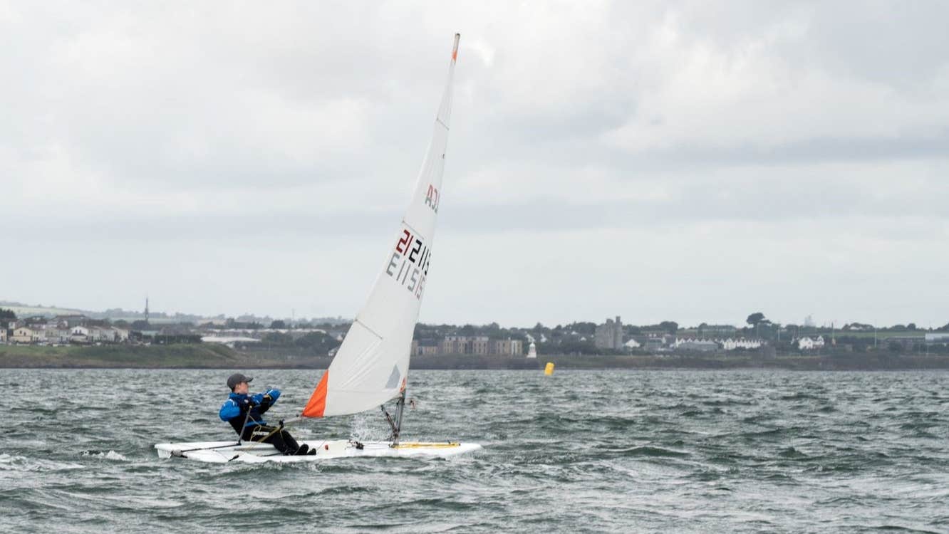 A boy sailing out on the water with Wexford Harbour Boat and Tennis Club