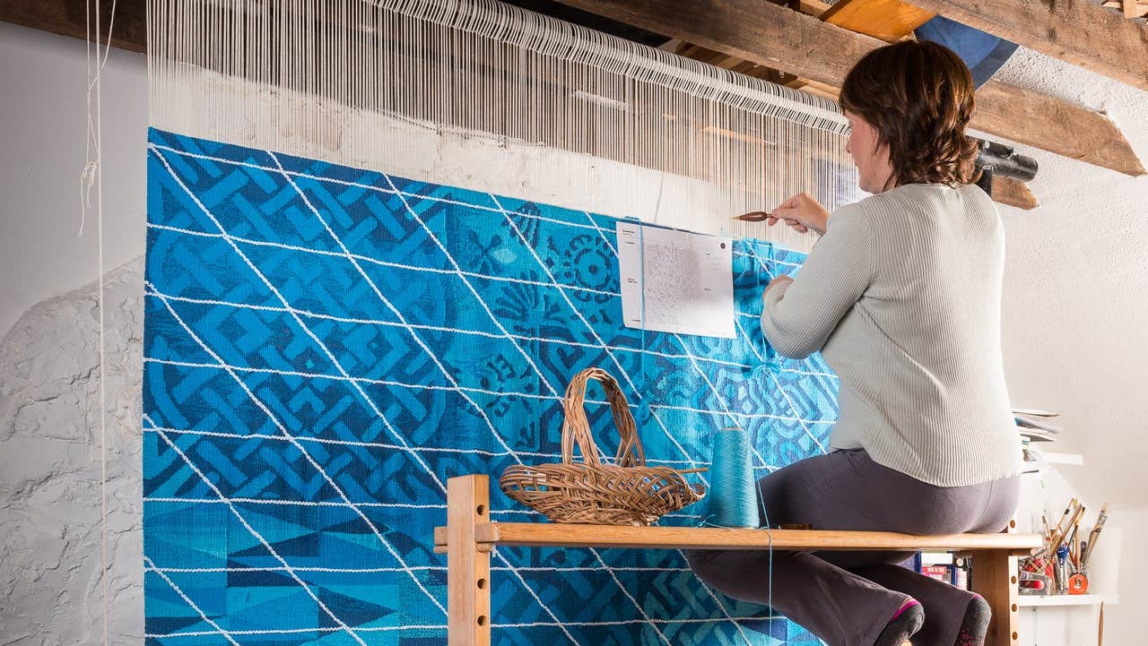 Áine Dunne hand weaving a specially commissioned piece for LinkedIn in her design studio