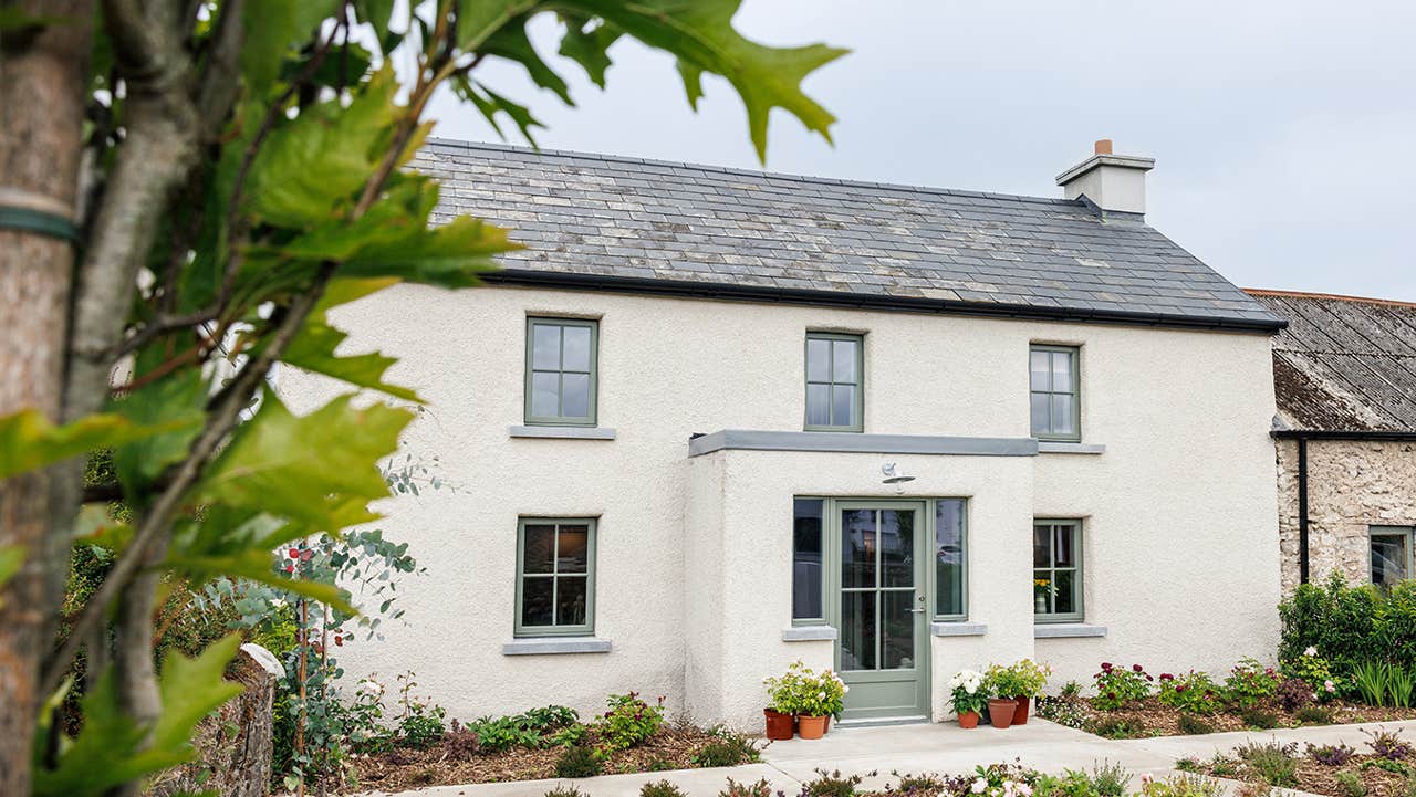 Entrance view of the property with garden area in the front.