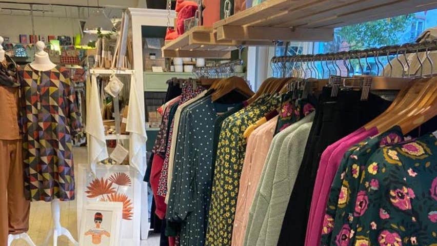 A selection of womens clothing on a rack