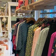 A selection of womens clothing on a rack