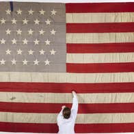 The flag of the Catalpa, with National Museum of Ireland Textile Conservator Lorna Rowley. Image © National Museum of Ireland