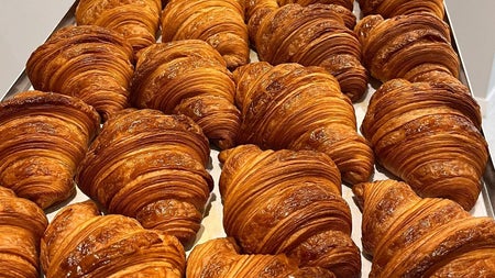A tray filled with croissants
