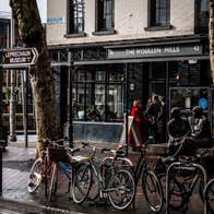Exterior of a restaurant on a busy city street