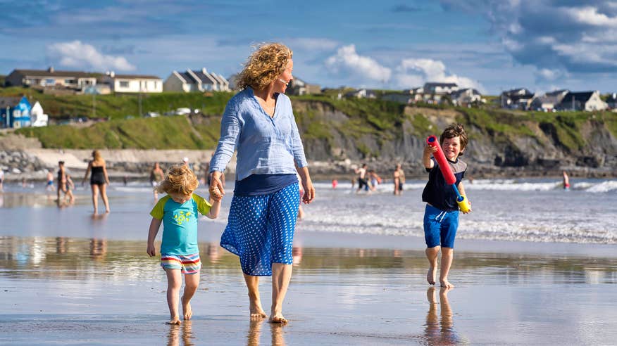 A family on Lahinch Beach in Co Clare