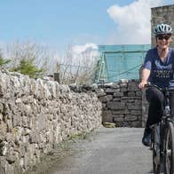 Woman on bike rented at e-whizz Kilfenora County Clare