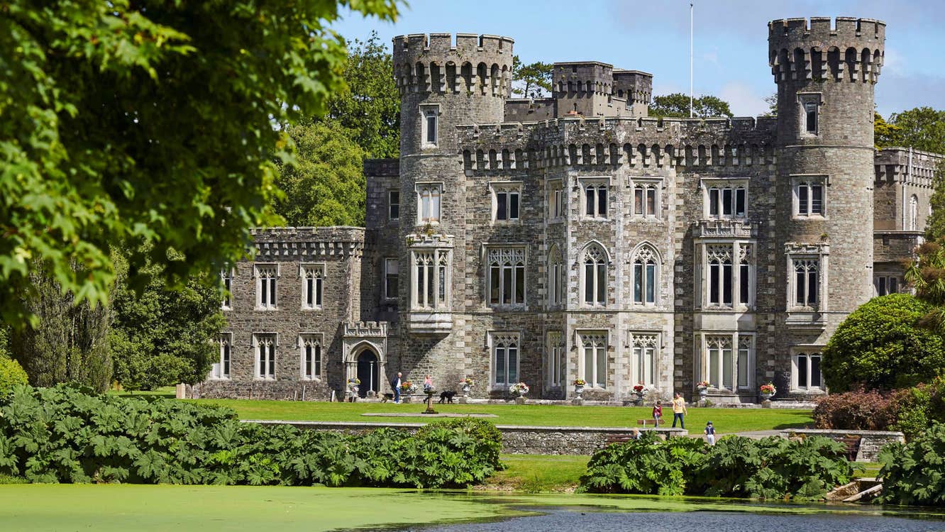 Johnstown Castle Estate exterior of the castle with the lake in front