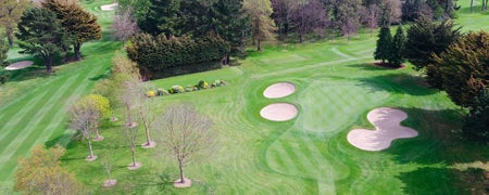 The fairways of Castle Golf Club with three sand dunes