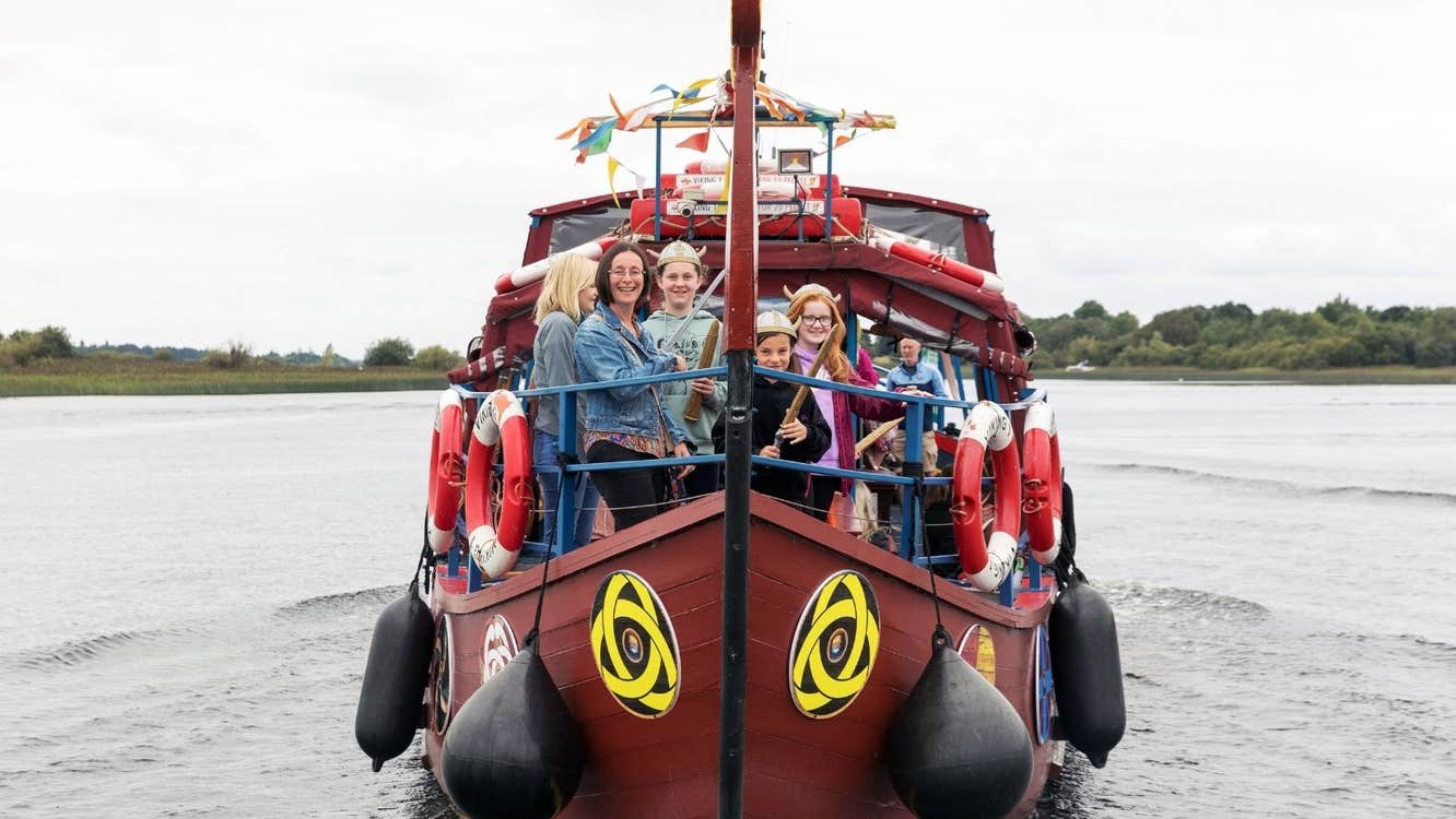 People cruising the River Shannon on board a Viking themed boat with Viking Tours