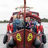 People cruising the River Shannon on board a Viking themed boat with Viking Tours