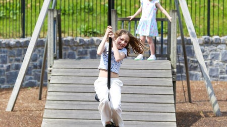 A girl enjoying the children's playground zipline at Ardgillan Castle and Gardens