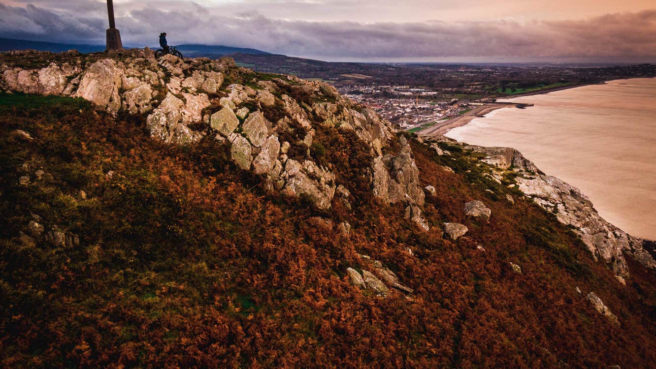 Cross on a hill looking out to sea with Bray in the background