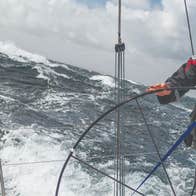A man driving a boat in County Sligo