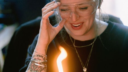 Woman with tattoo making jewellery at Silverworks