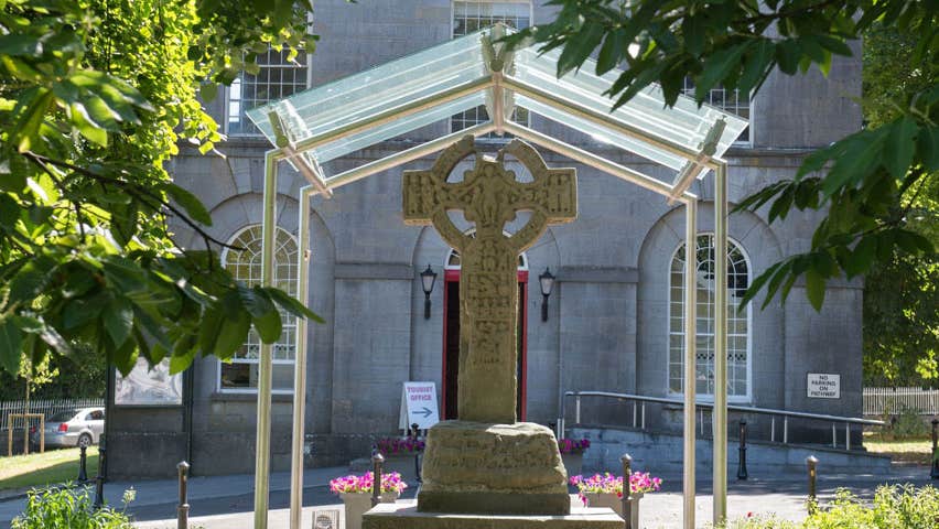 An ancient stone high cross outside Kells Courthouse
