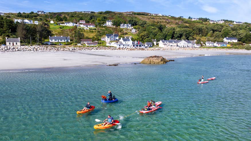 People kayaking with Cumann na nBad Water Sports School on Árainn Mhór (Arranmore), Co Donegal