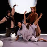3 people dancing on a stage