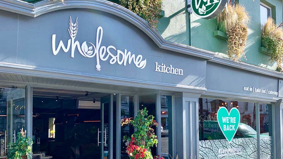A view of the front door and entrance to the Wholesome Kitchen