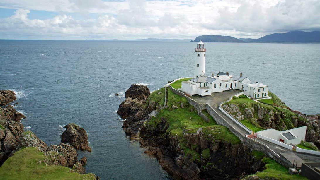 Fanad Lighthouse overlooking the ocean in County Donegal, Ireland.