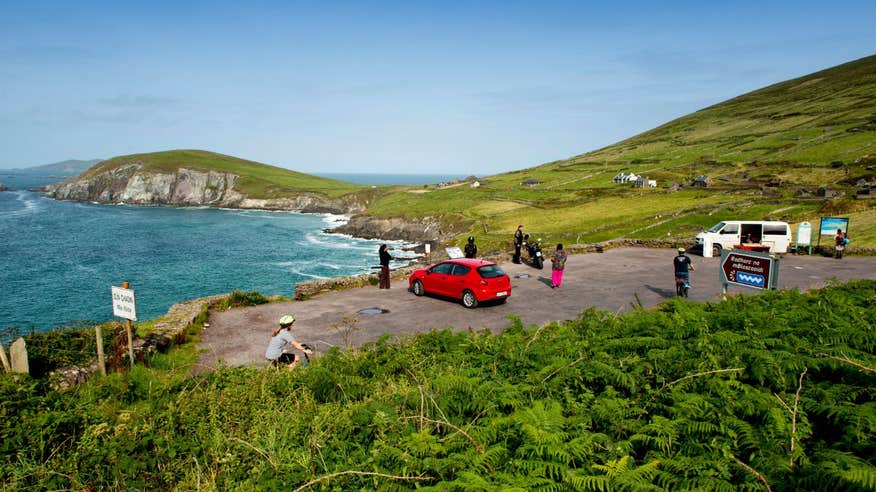 Groups of drivers and cyclists taking the view at Slea Head, Co. Kerry