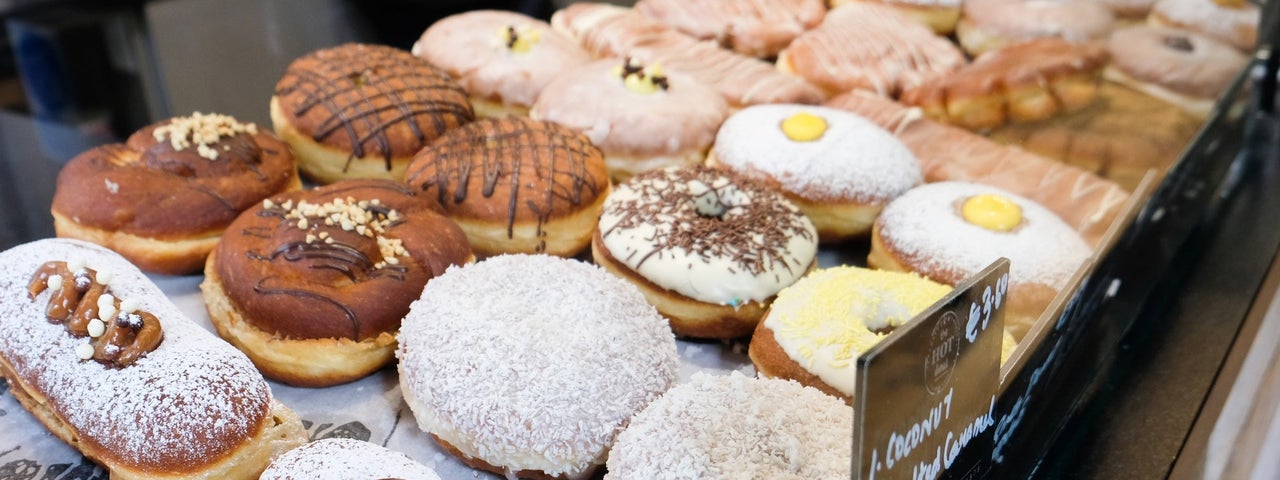 A selection of colourful doughnuts in a shop