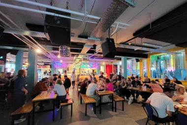 A busy dining area with lots of people seated