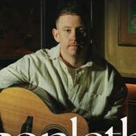 Irish singer-songwriter Conleth McGeary with a guitar.
