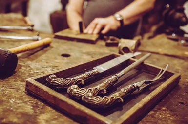 A person working with tools at a work bench