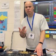 A man operating DJ equipment.