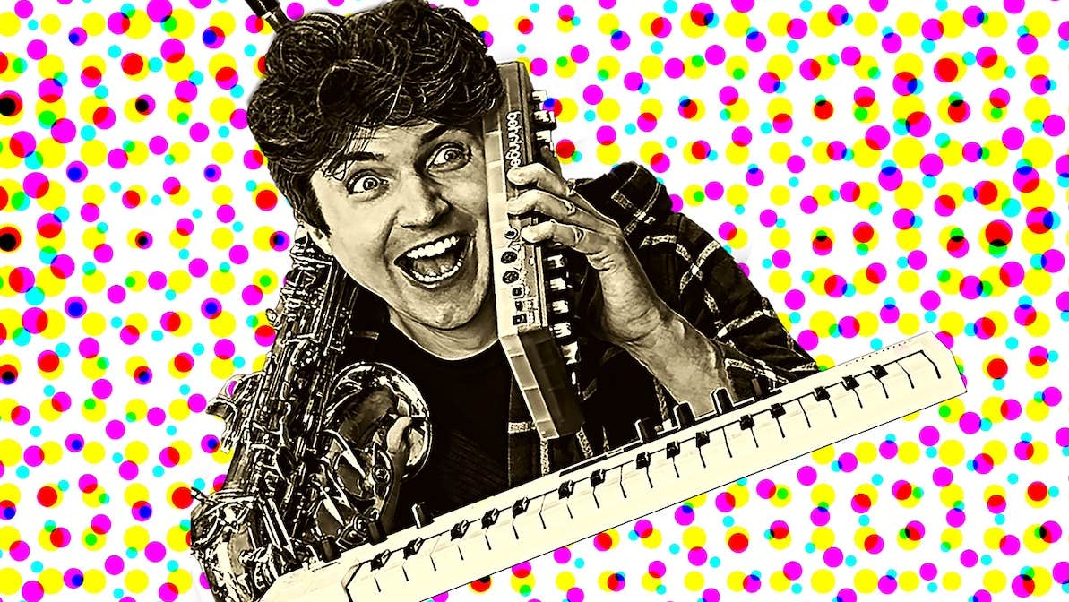 Surprised looking man hold up a small electronic device to his ear with a keyboard and a saxophone, against background of lines of coloured dots