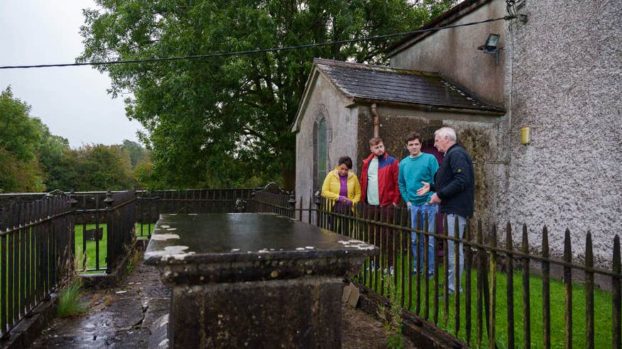 Group learning about history at a famous grave site.