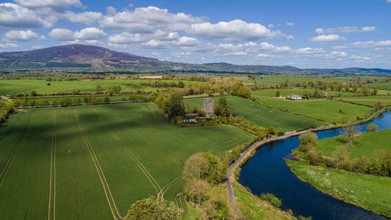 An aerial image a river winding through open fields