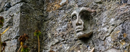 An ancient stone figure on a wall