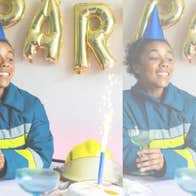Lola, a firefighter, sits surrounded by birthday decorations
