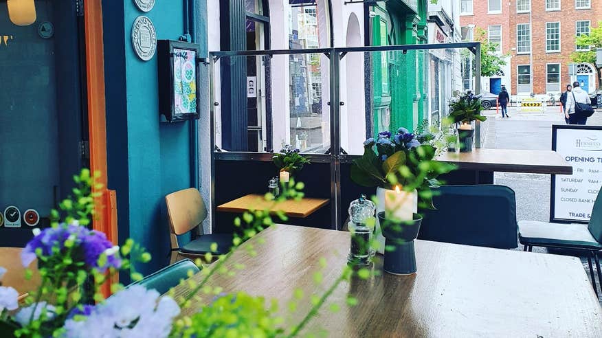 Fresh flowers in a colourful outdoor dining area at Orso Kitchen and Bar, Cork City