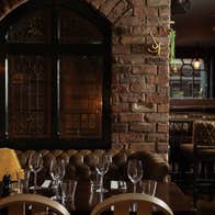 Dark wood tables prepared for dining